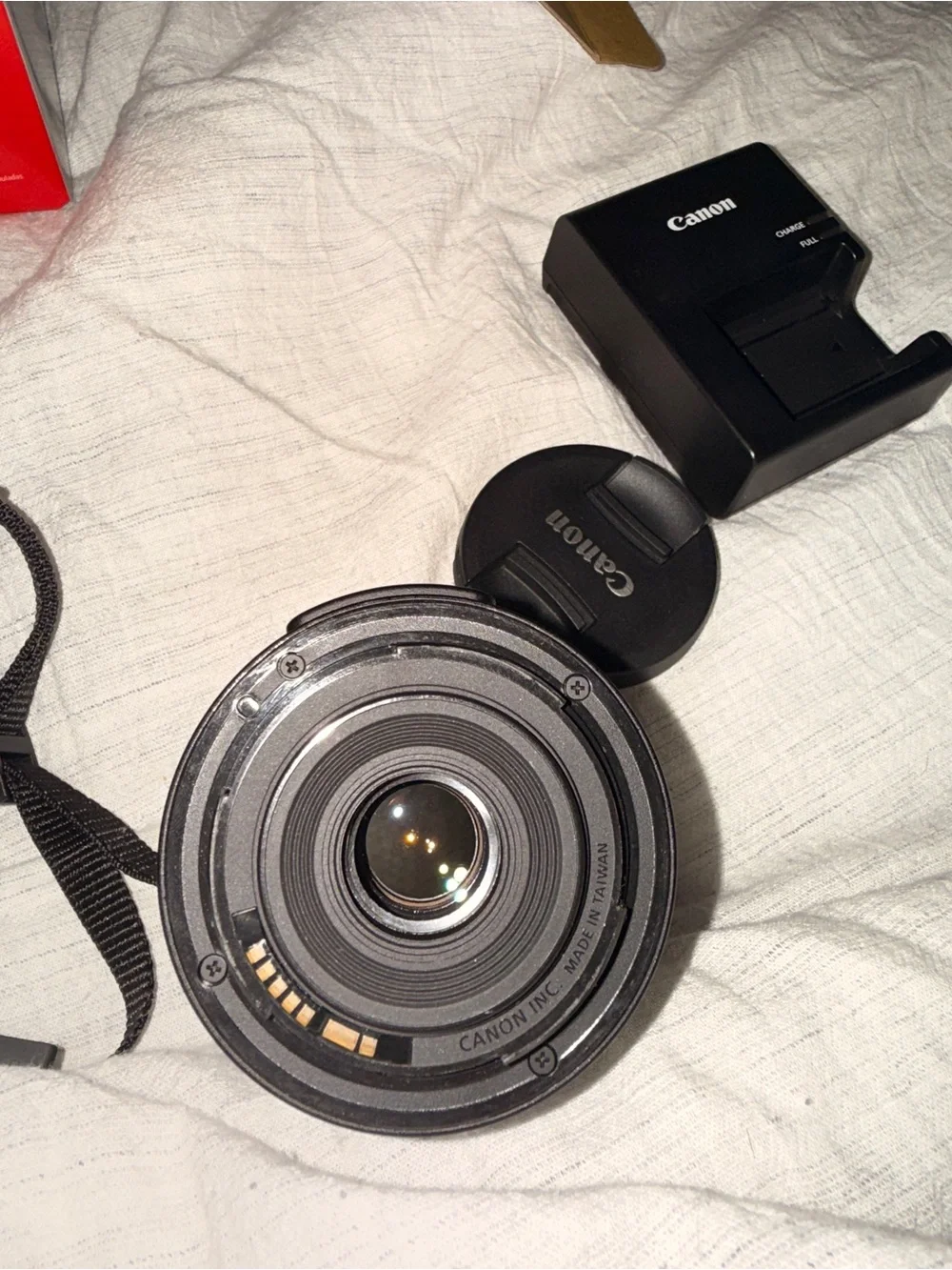 Canon DSLR Camera in Black with Red Strap Accent